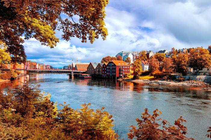 shu-Europe-Norway-View-through-autumn-foliage-to-Nidelva-river-Trondheim-city-435887431-Edgieus-HERO-1440x823