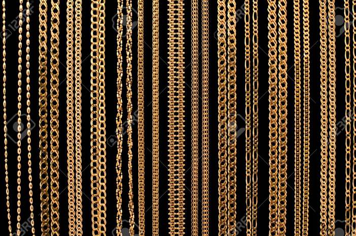 6034735-many-gold-chain-necklaces-over-black-background