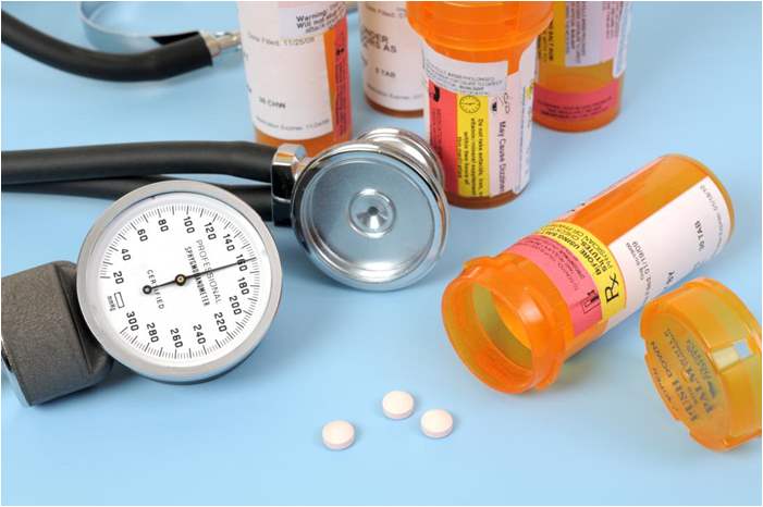 bottles-of-pills-with-a-stethoscope-and-blood-pressure-meter