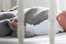 PROD-A-newborn-baby-boy-sleeping-in-his-cot