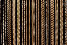 6034735-many-gold-chain-necklaces-over-black-background