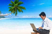 businessman_working_on_beach_robert_churchill