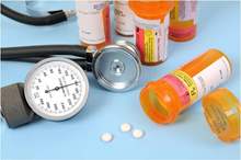 bottles-of-pills-with-a-stethoscope-and-blood-pressure-meter