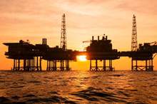getty-offshore-oil-rig-silhouette-sunset-1