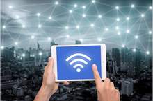 hand-holding-tablet-with-wifi-icon-on-city-and-network-connection-concept--bangkok-smart-city-and-wireless-communication-network--abstract-image-visual--internet-of-things--627698790-593f28255f9b58d58add7